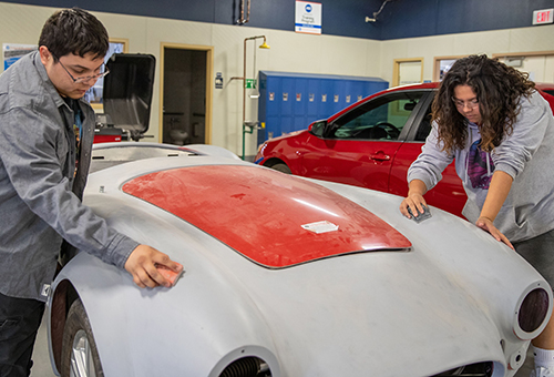 Collision Repair students in the shop, doing body work