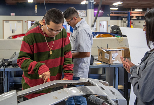 Collision Repair students in the shop, doing body work