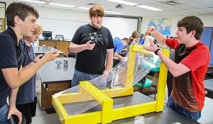 Physics students in lab experiment