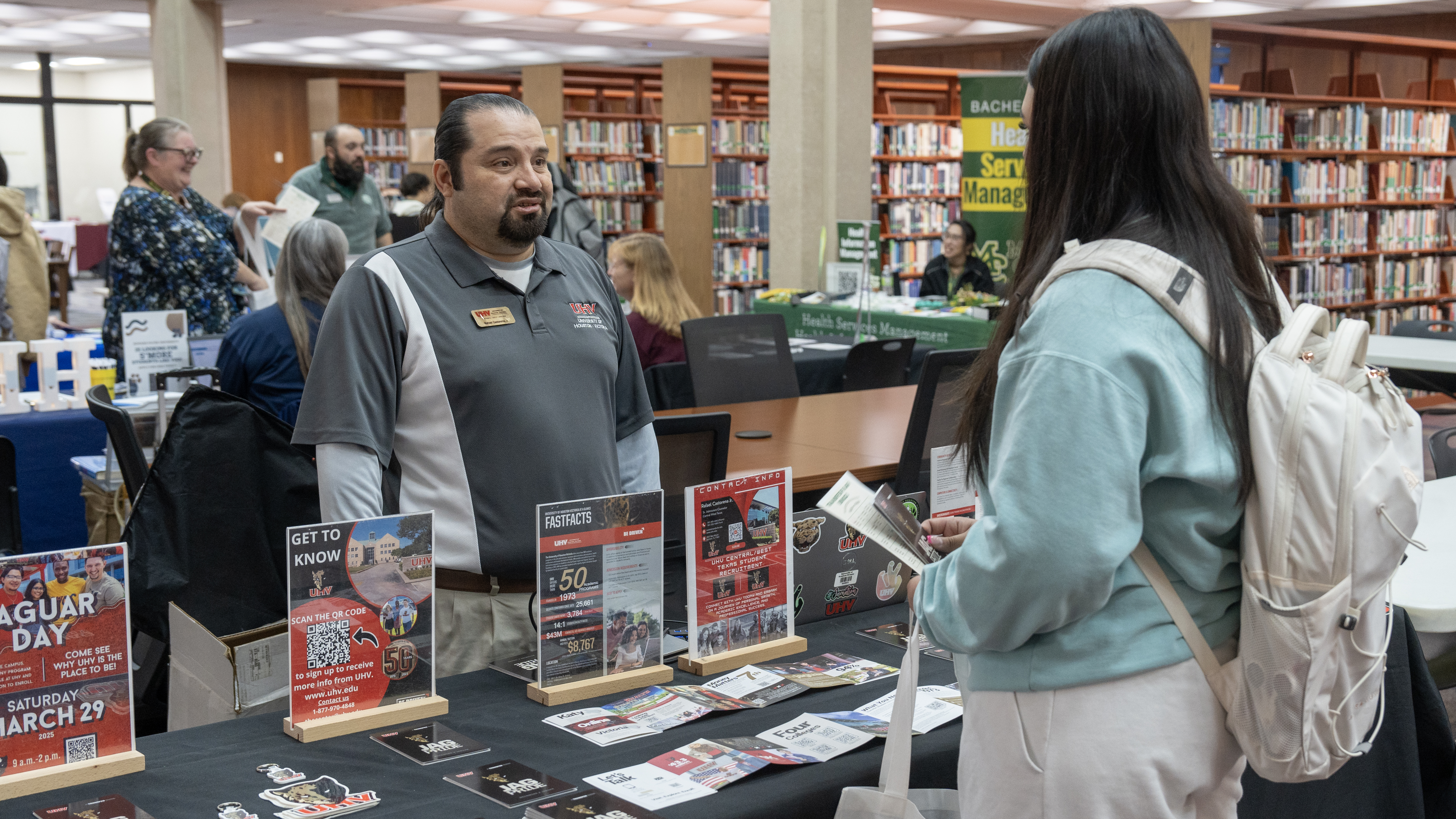 2025 Transfer Fair student learning more information about UHV