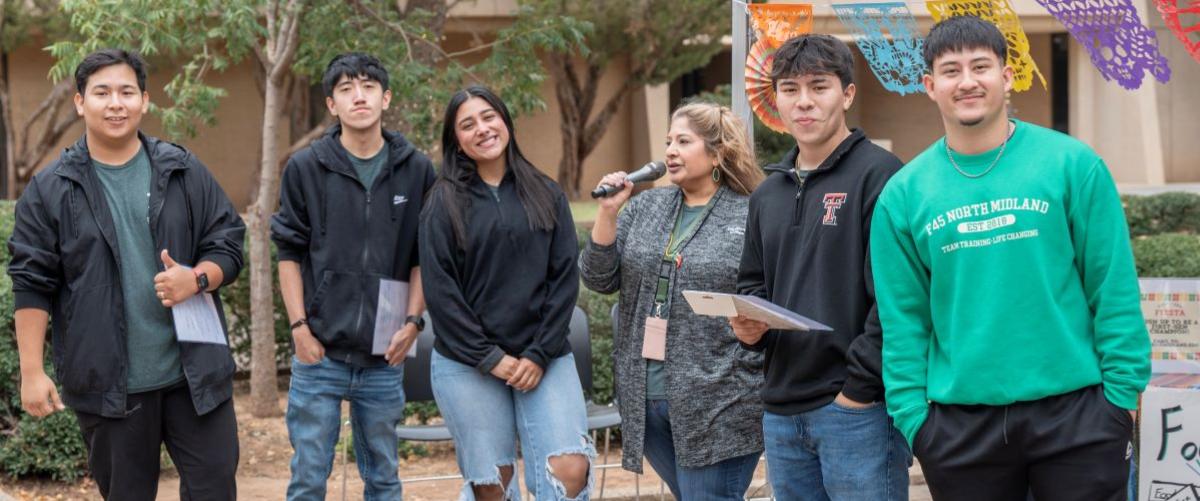 Midland College students sitting at Beal Plaza