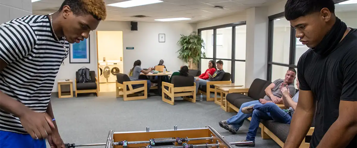 Students playing foosball