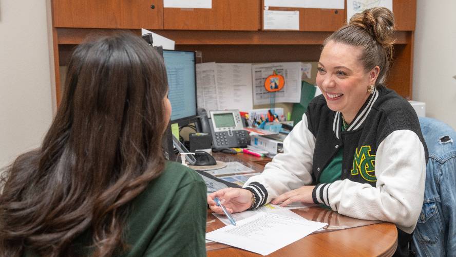 advisor and student interacting