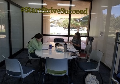 Picture of room with students sitting at the table