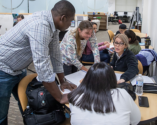 Math lab instructor assisting students