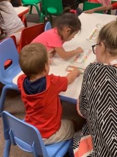 Children and instructor in MC's Pre-K Academy